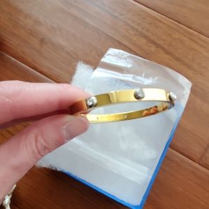 Henri Bendel yellow gold bangle